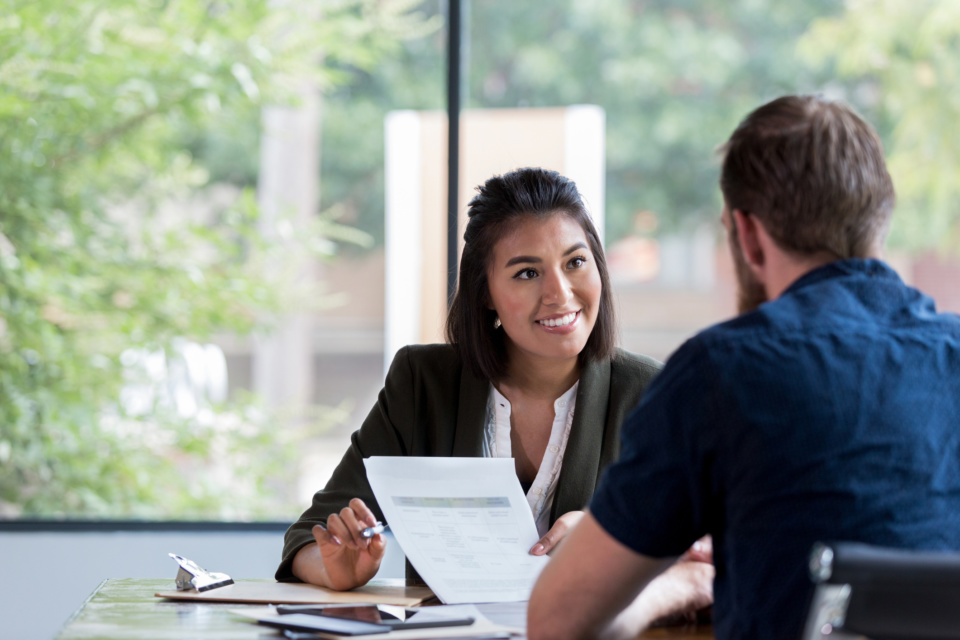 Cheerful businesswoman meets with client 1181008199 2125x1416