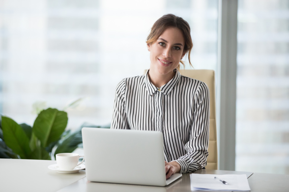 Head shot portrait of confident businesswoman at workplace 1073416040 2125x1416