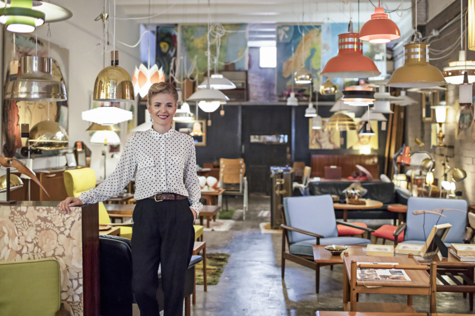 Portrait of a female business owner standing in her furniture store 864246514 2125x1416