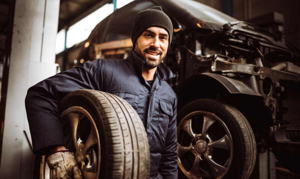 Mechanic man repair a tire 1126886132 2245x1341